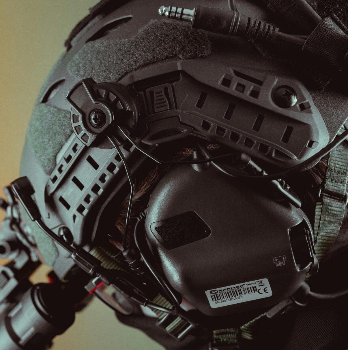 Close-up of a tactical helmet equipped with night vision gear, emphasizing technology.